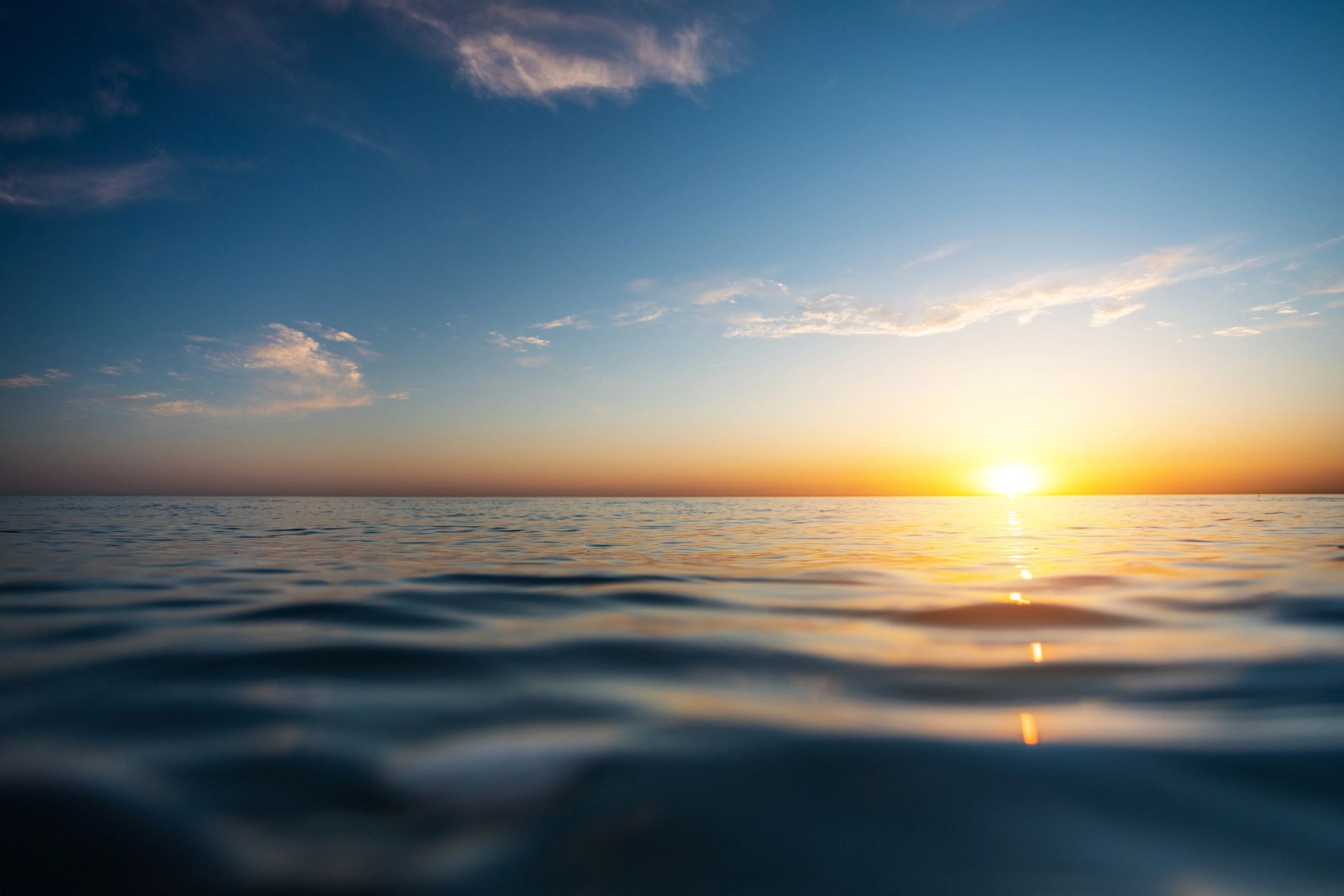 Calm ocean sunset representing peace and healing